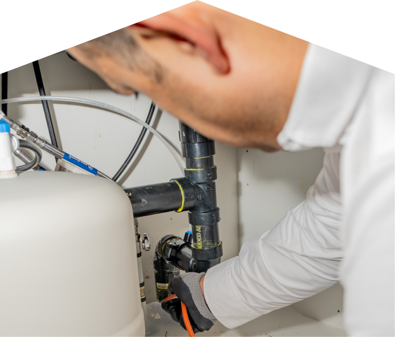 A Home Aire Care plumbing specialist uses a hydro jet to clear a clogged drain. A Home Aire Care plumbing specialist uses a hydro jet to clear a clogged drain.